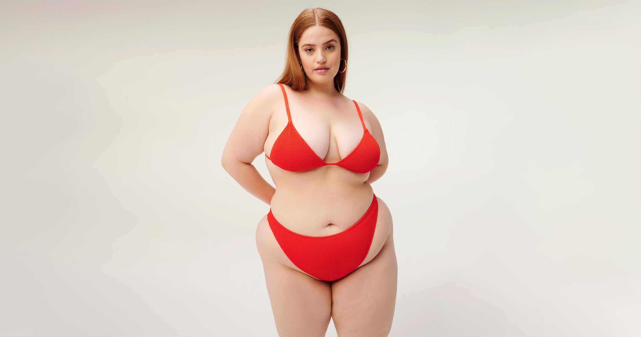 full torso photo of a female swimwear model