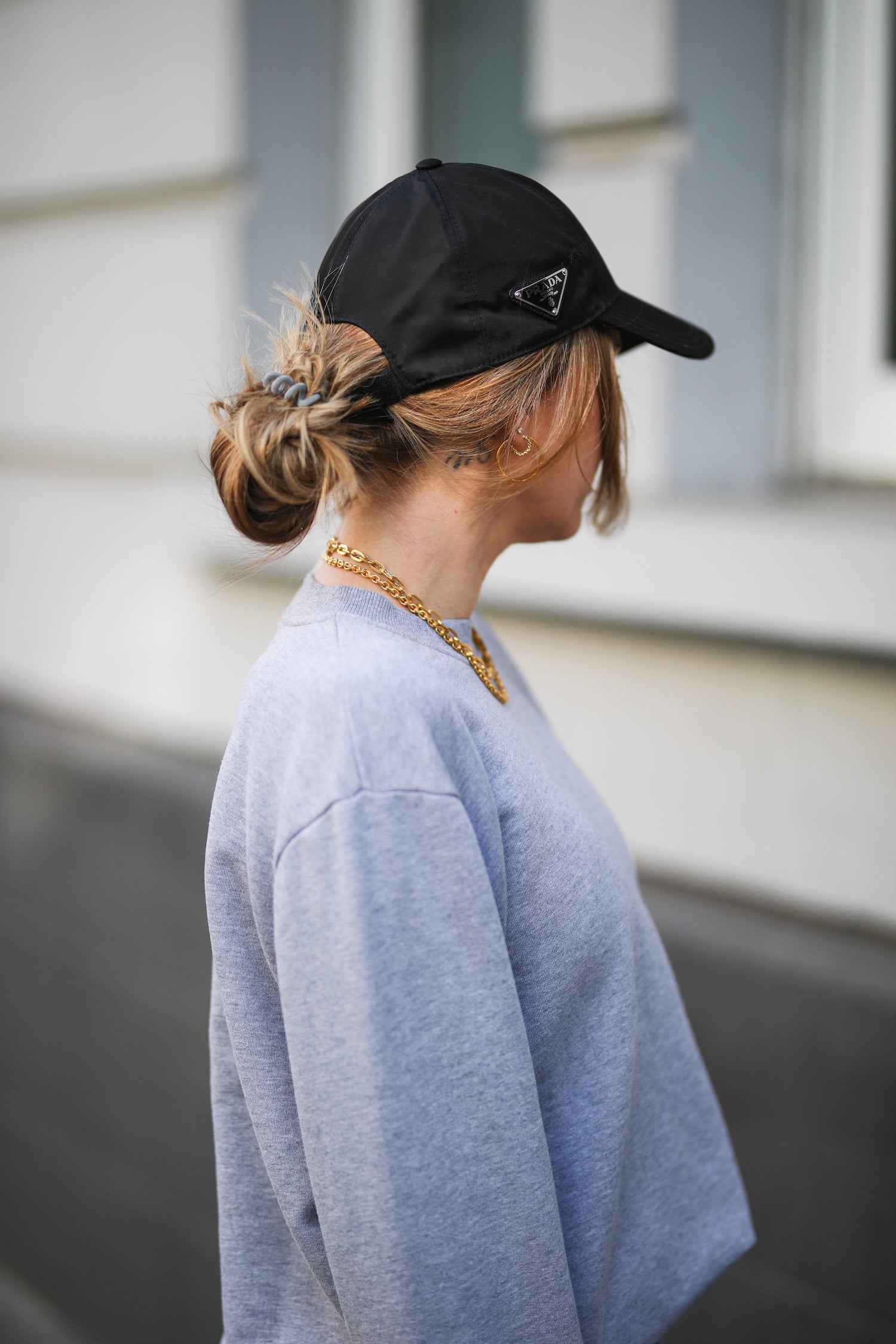 Messy bun with cheap baseball cap