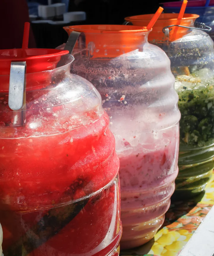Large Containers of Mexican Aguas Frescas Drinks at Carnival