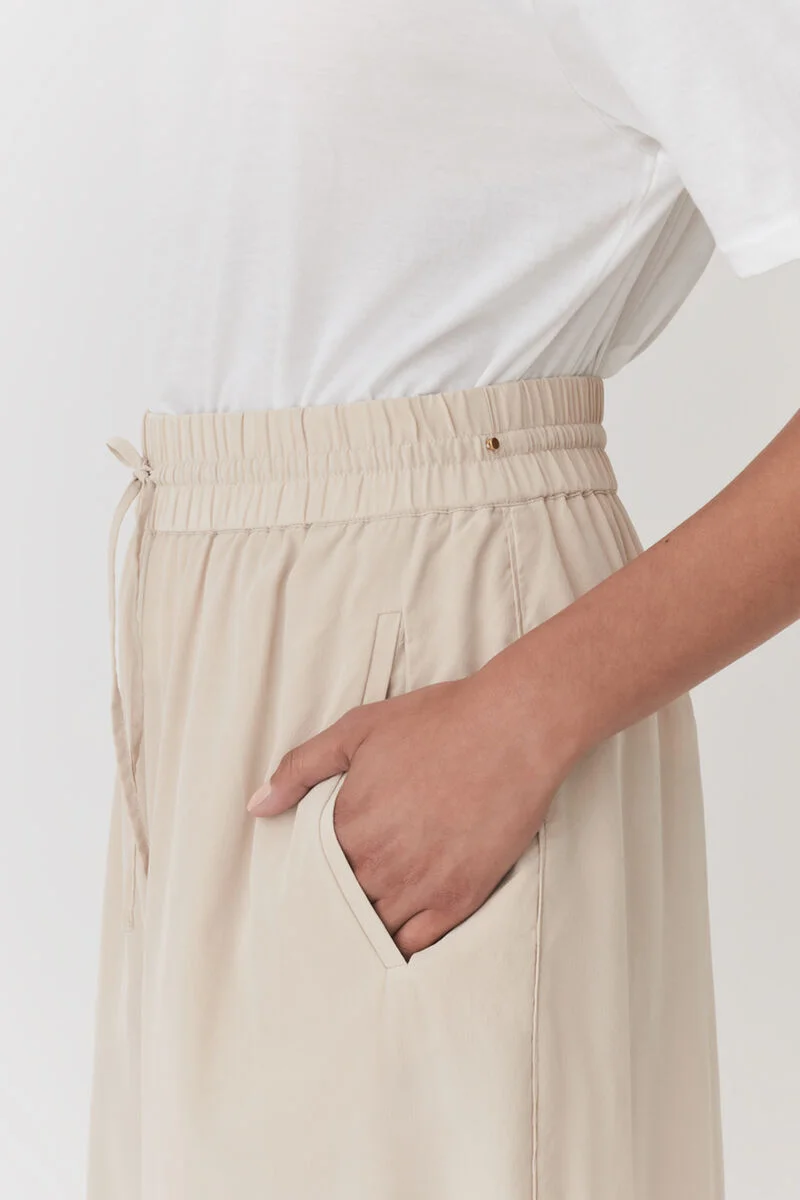 Shine in silk. Swipe to see two ways to wear our Washable Silk Wide-Leg  Cropped Pant.