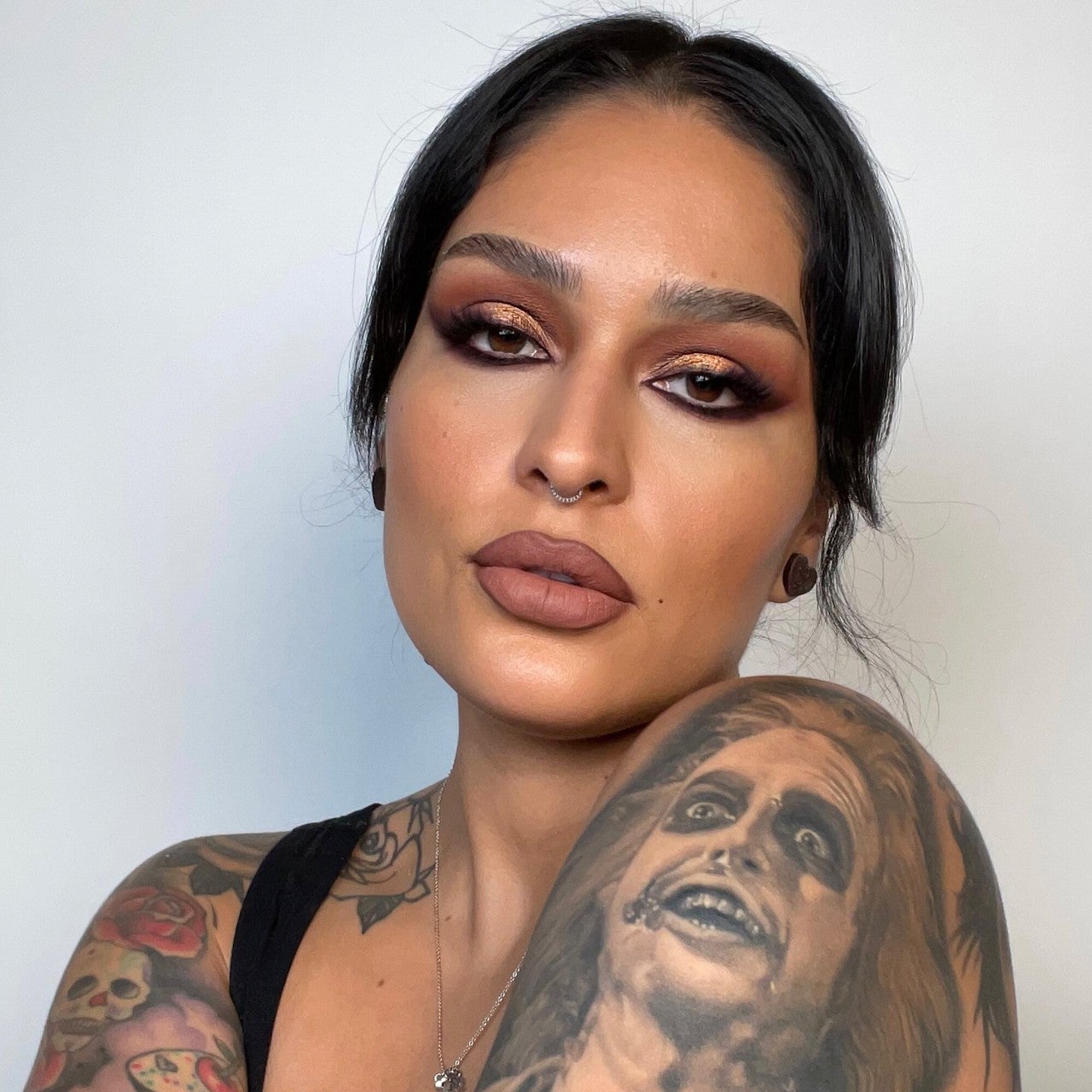 This photo of a face tattoo being covered up shows how Kat Von D's makeup  can pretty much cover anything