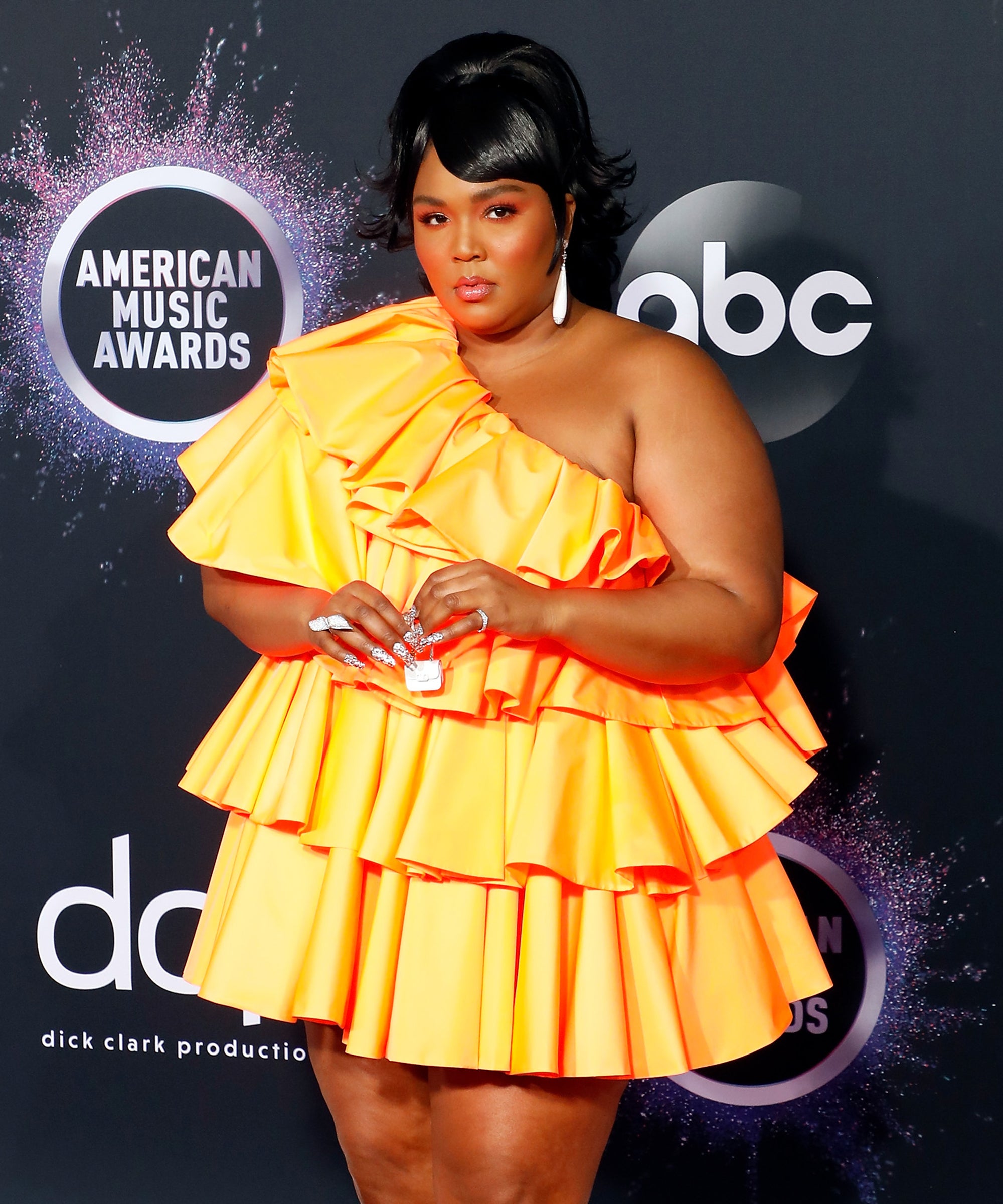 How Lizzo's Tiny Bag Became a Meme and Took Over the Internet - FASHION  Magazine