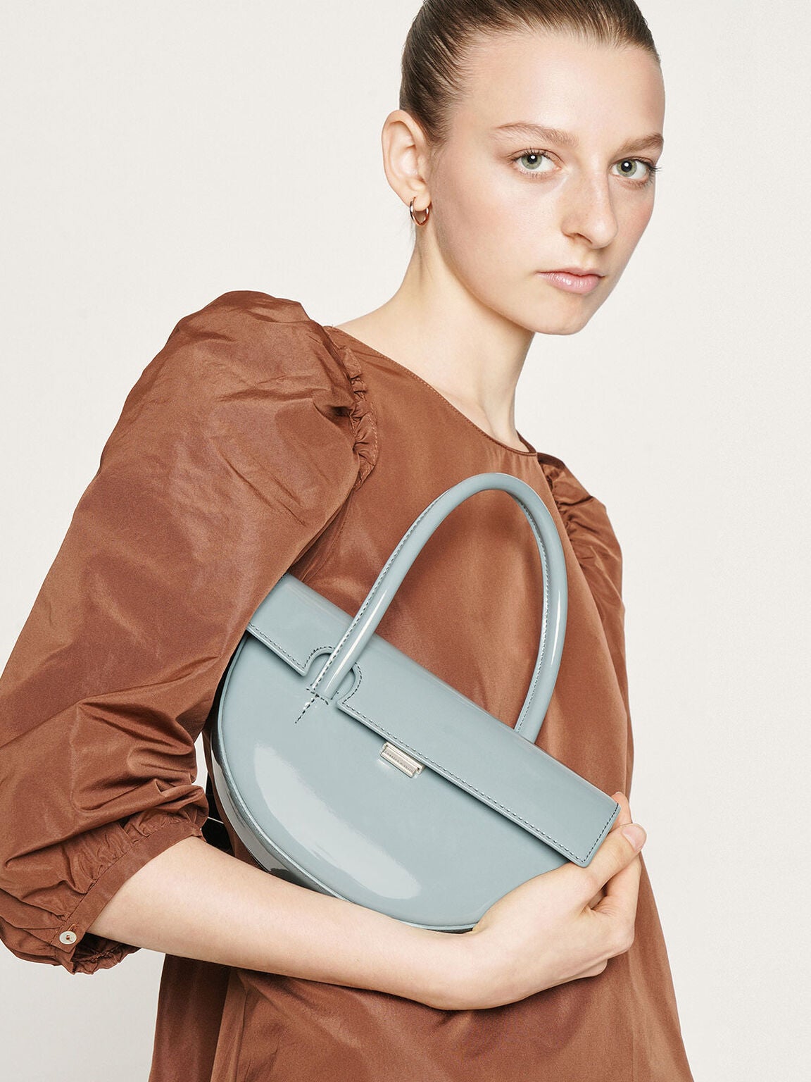 Charles Keith Patent Top Handle Semi Circle Bag